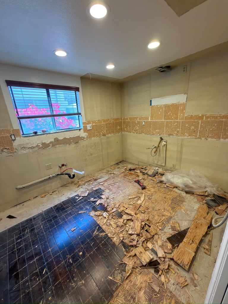 Pasadena kitchen gutted to the studs, with the plumbing opened up