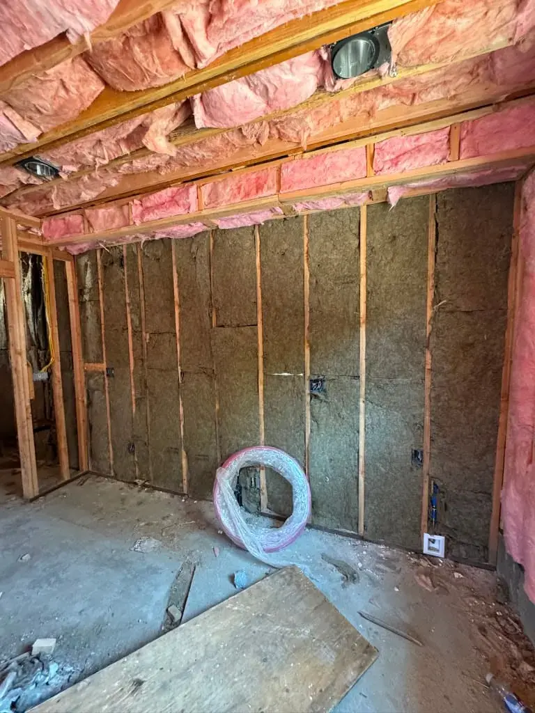Insulated stud walls inside the converted garage